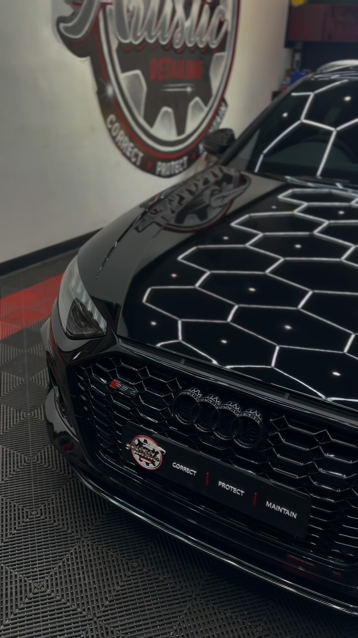 Paint finish detail on black vehicle hood