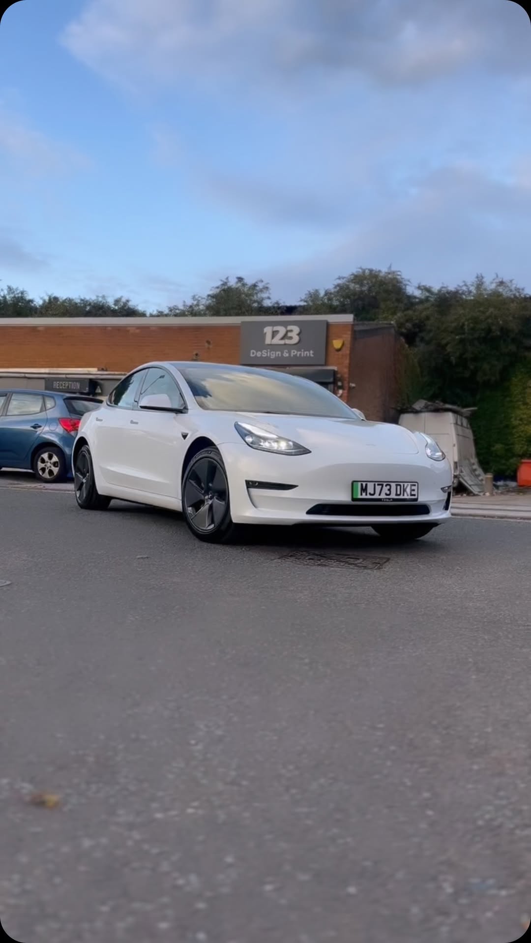 New car detail on white Tesla