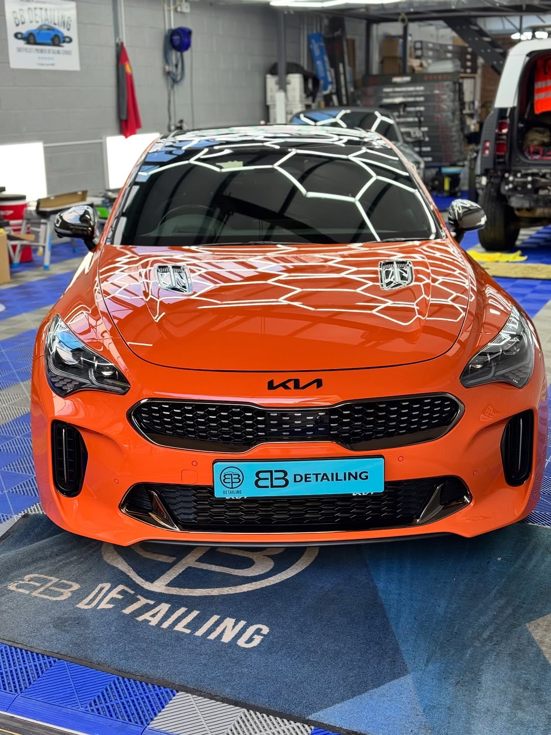 Mirror-like finish on a sports car after paint correction