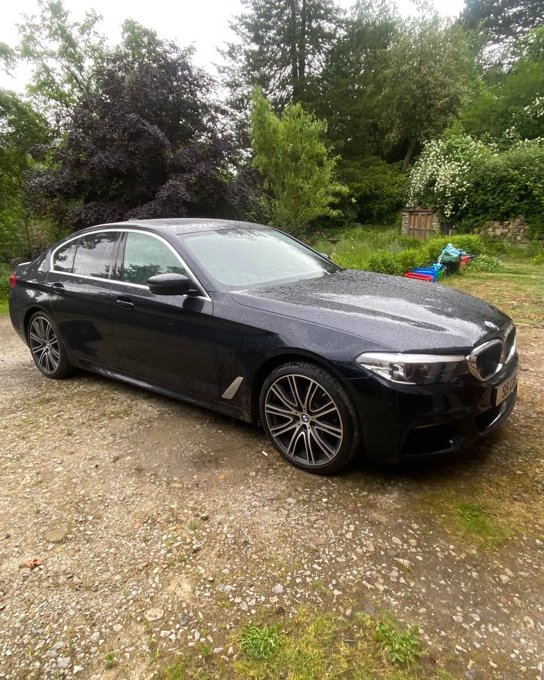 Black BMW coupe with deep wax gloss