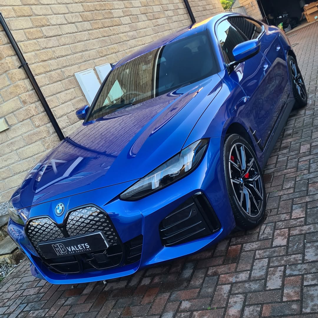 Blue BMW luxury sedan shiny finish by MB Valets