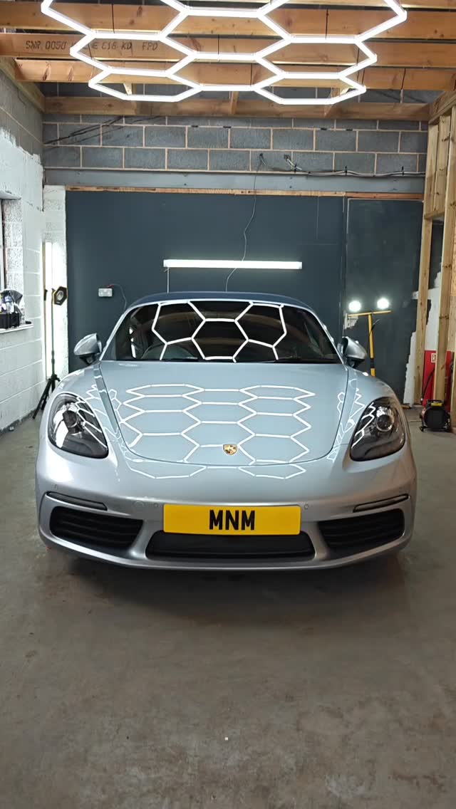 Silver Porsche at MNM Details unit showroom in Knowle