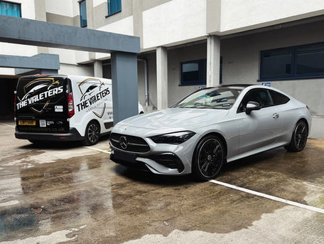 White Mercedes with service van