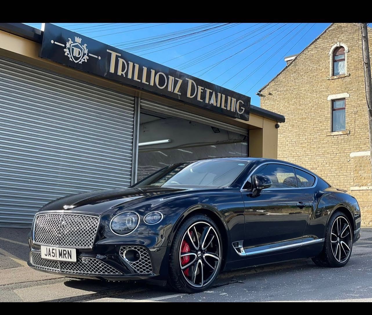 Bentley parked outside facility