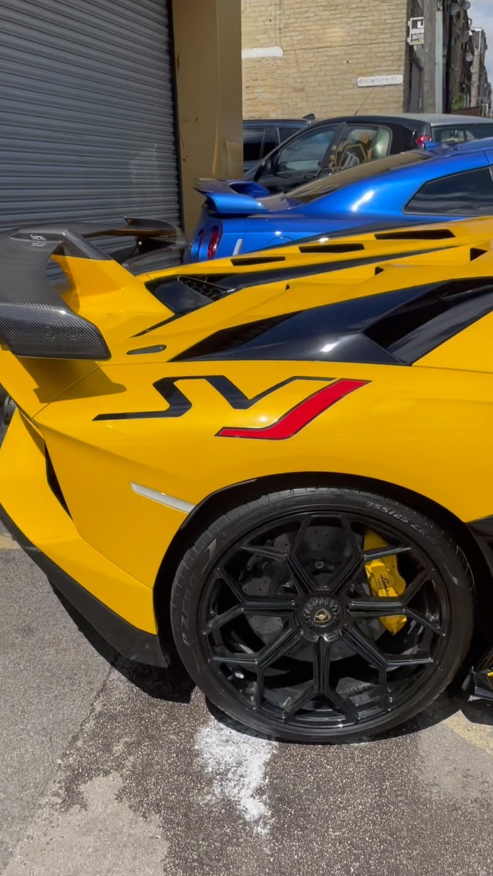 Yellow and blue premium sports cars after full exterior detail