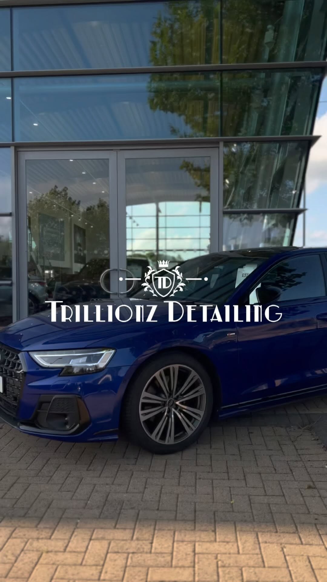 Blue sports car receiving premium exterior detailing at Trillionz studio